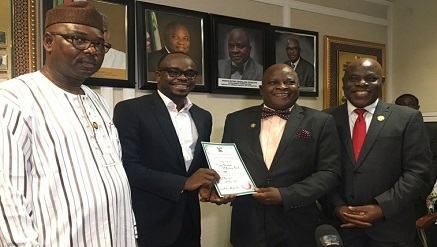 *(L-r): Olabingo Adeyemi, special adviser to Governor Akinwunmi Ambode on Commerce, Industry and Cooperative observes as Mr. Hillary Nwaukor, founder of i-Naira.com receives his auction practicing license from Prince Rotimi Ogunleye, Lagos State Commissioner of Commerce, Industry and Cooperative, while Fariudeen Akodu, permanent secretary in the Ministry acknowledges, during the occasion held at the Ministry Conference room on Monday, Lagos State.